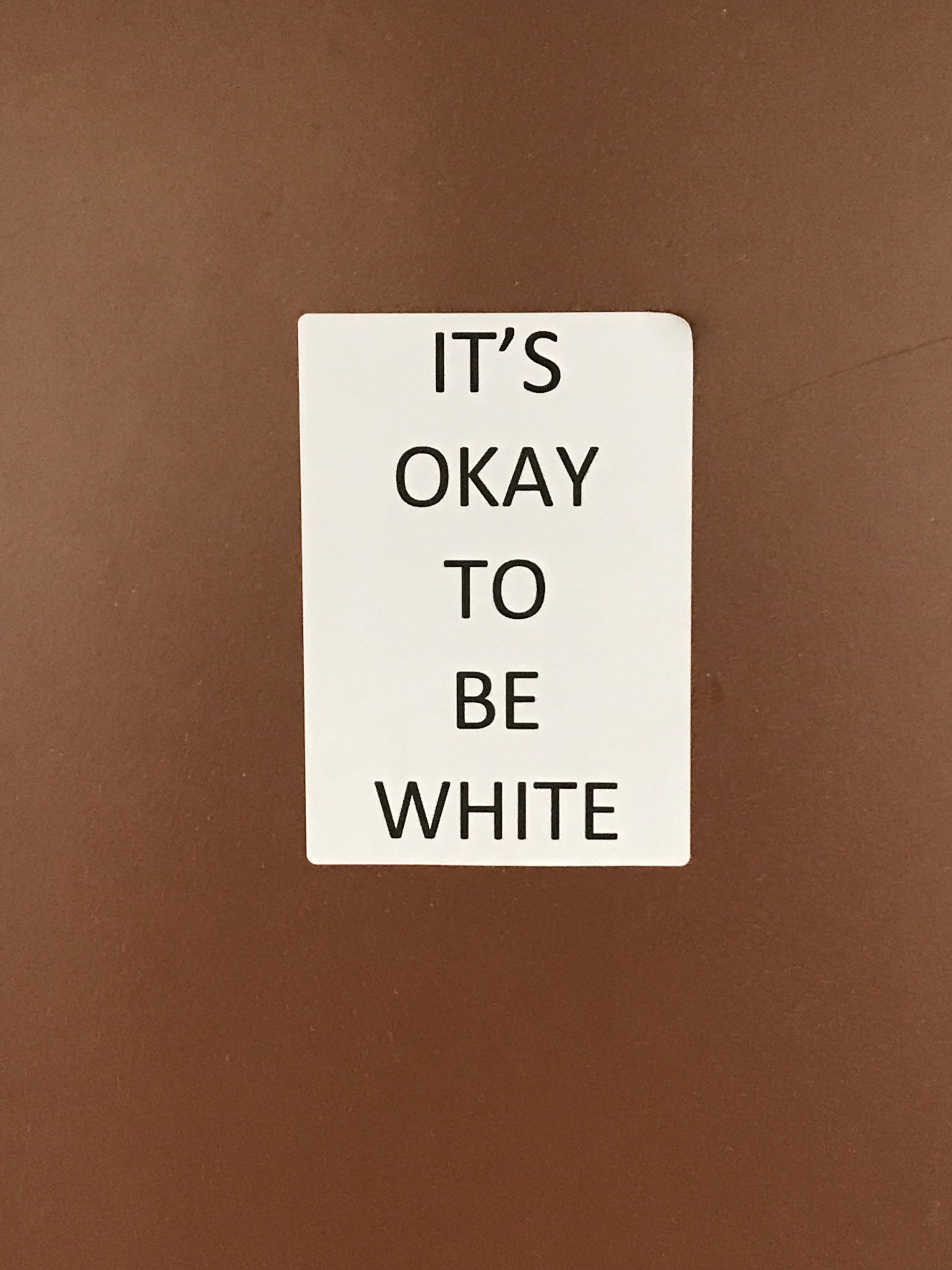 Thumbnail for “It’s OK to be white” stickers appear across the SPHS campus